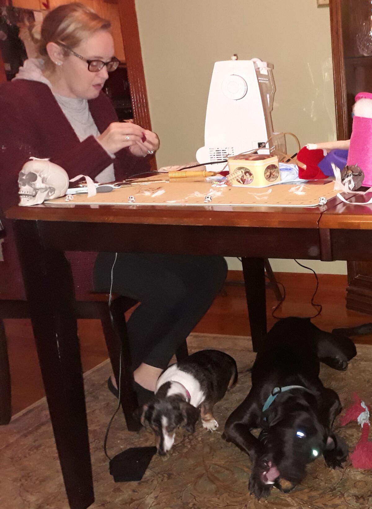 Christina doing Halloween crafting with the dogs under foot. They are always hanging out.