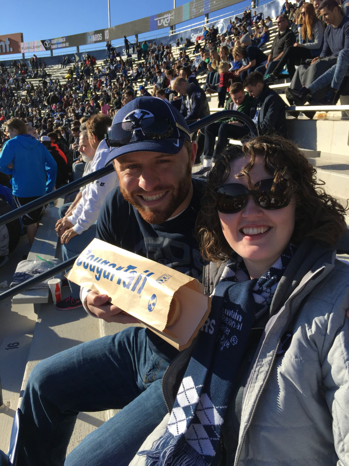 At the football game, about to devour this "cougar tail" (a footlong maple bar)